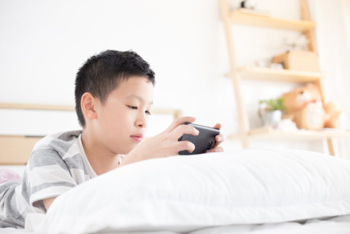 children watch TV and play gadgets