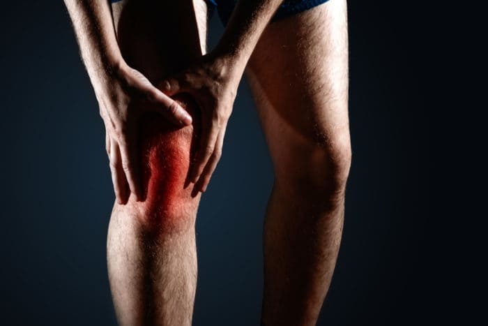 symptoms of inflammation of the knee joint
